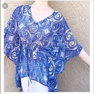 Jennifer Lopez asymmetrical sheer sequin top